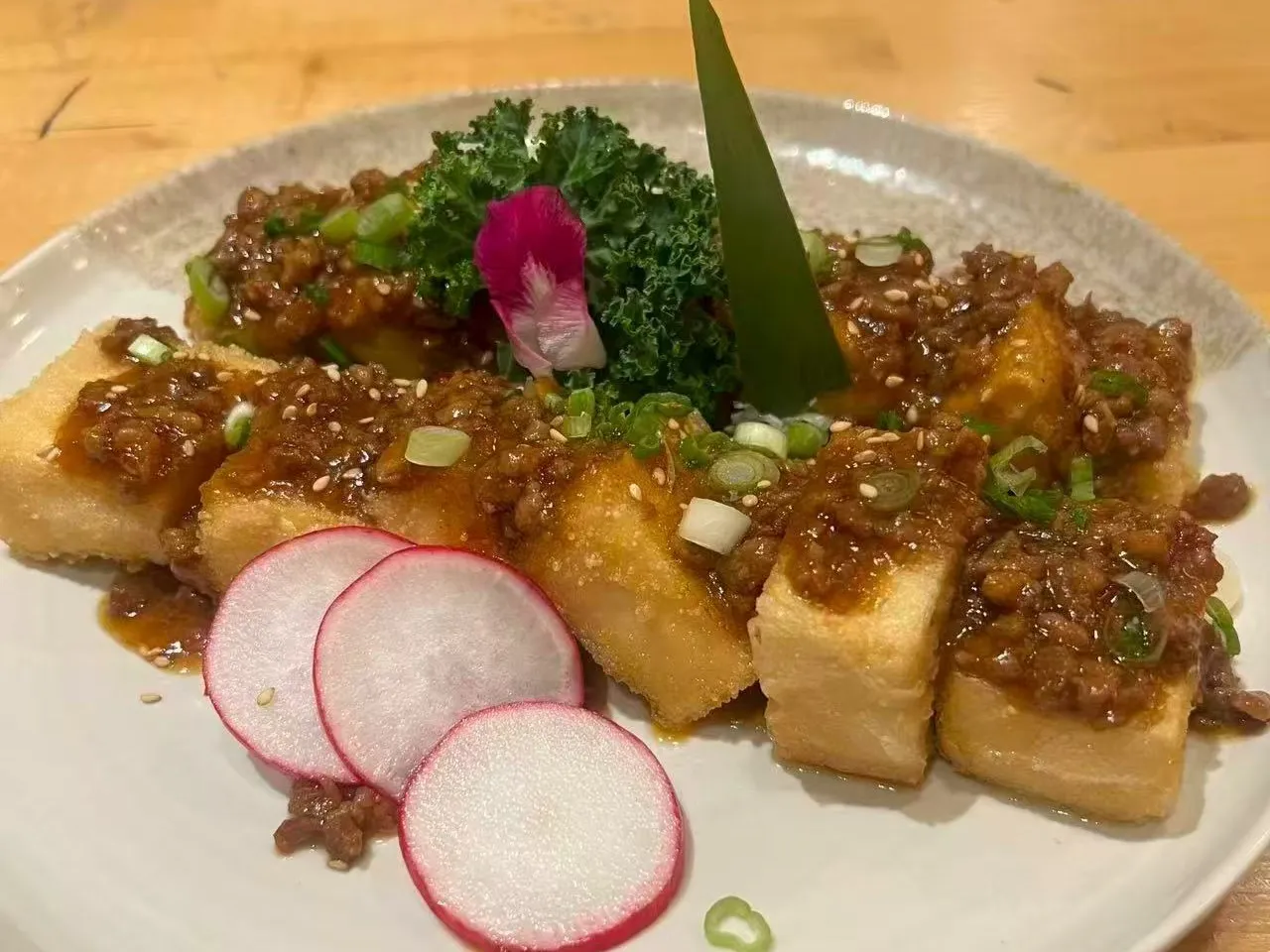 Braised soft tofu topped with minced pork sauce and sliced radish at Chengdu Impression Chinese Restaurant in Schenectady